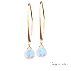 "Shimmering moonstone crystals are wire wrapped and dangling from long handmade earwires, Being June Birthstone, Moonstone Earrings make a wonderful June Birthday gift. Matching necklace: https://etsy.me/2RBNjvi M A T E R I A L S: * natural rainbow moonstone * dangling from: french hooks / long earwires / leverbacks * 14k Gold Filled / 14k Rose Gold Filled / Sterling Silver / 14k Solid Gold * come in our beautiful gift box along with descriptive stone card SIZE: * moonstone briolettes are about Moonstone Briolette Jewelry With Ear Wire, Minimalist Moonstone Jewelry With Ear Wire, Moonstone Dangle Hoop Earrings As Gift, Moonstone Dangle Hoop Earrings For Gift, Minimalist Moonstone Dangle Earrings, Elegant Wire Wrapped Moonstone Earrings, Minimalist Moonstone Drop Earrings, Elegant Moonstone Wire Wrapped Earrings, Minimalist Moonstone Earrings For Anniversary