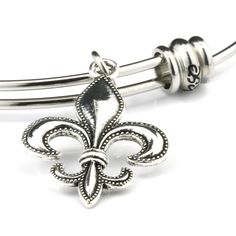 PRICES MAY VARY. Fleur de Lis Jewelry for Women that love the Saints or have origins with the Fleur de Lis History A Charm for Louisiana Jewelry or Louisiana Gifts for Women or Fans of the New Orleans Saints Fluer de Lis Jewelry for those with French Origins or for those that are LSU Students or Faculty LSU Bracelets for Women with Fleur de Lis Charm or Fleur de Lis Emblem for Women or Men New Orleans Saints Jewelry for Women on a Stainless Steel Bangle with a Fleur de Lis Charm Fleur de Lis Gif Classic Adjustable Nickel-free Charm Bracelet, Classic Adjustable Charm Bangle Bracelet, Classic Adjustable Bangle Charm Bracelet, Louisiana Jewelry, Louisiana Gifts, Fluer De Lis, French Royalty, Saint Jewelry, Stainless Steel Bangles