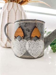 These statement drop earrings are reminiscent of leaves and hearts and will  transition throughout the seasons.  These boho inspired earrings are the perfect gift for your friends and loved ones.  Made from laser cut wood and engraved acrylic. Wood may have slight variations in color and grain.   Gift wrapping available in store for purchase. Engraved Acrylic, Earrings Fall, Heart Earring, Anniversary Gift For Wife, 5th Anniversary, Statement Earring, Statement Drop Earrings, Anniversary Gifts For Wife, Wood Earrings