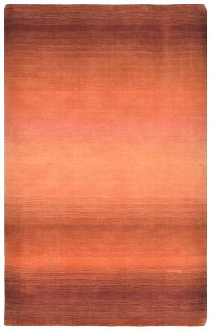 an orange and brown rug with horizontal stripes