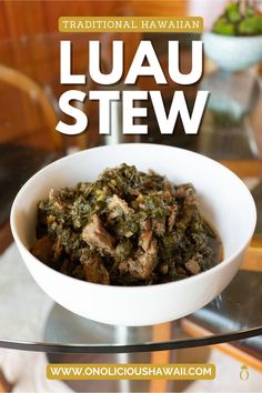 a white bowl filled with food on top of a glass table