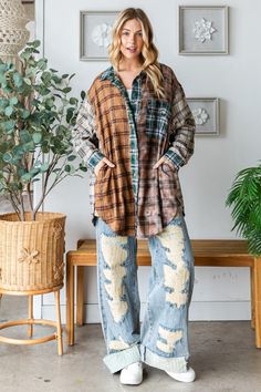 Express Your Unique Style with Our Mixed Plaid Button-Front Top Add a touch of eclectic charm to your wardrobe with our Mixed Plaid Button-Front Top. Designed for trendy moms who love to stand out, this top features a creative blend of plaid patterns in rich, earthy tones. The relaxed, oversized fit and long sleeves make it perfect for layering over your favorite tees or wearing on its own for a casual, laid-back look. The button-front design adds versatility, allowing you to style it open or cl