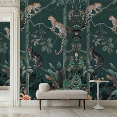 the wallpaper in this room is decorated with leopards and tropical plants, including leaves