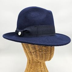 Step back in time with our Women's 1930's Wool Felt Hat, a timeless accessory that channels the elegance and grace of a bygone era. Crafted with meticulous attention to detail, this hat is inspired by the iconic fashion of the 1930s, offering a perfect blend of vintage charm and modern sophistication. Made from high-quality wool felt, this hat boasts a classic silhouette that captures the essence of 1930s style. With its medium brim and tailored design, it exudes understated elegance and complem Classic Adjustable Brimmed Cloche Hat, Classic Wool Cloche Hat With Curved Brim, Classic Wool Cloche Hat With Flat Brim, Vintage Adjustable Fur Felt Fedora, Classic Adjustable Cloche Hat With Curved Brim, Classic Wool Cloche Fedora, Classic Cloche Hat With Adjustable Short Brim, Classic Wide Brim Cloche Hat, Classic Adjustable Cloche Hat With Short Brim