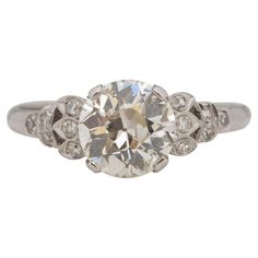 Ring Size: 8 Metal Type: Platinum [Hallmarked, and Tested] Weight: 3.7 grams Center Diamond Details: GIA REPORT #: 2225163086 Weight: 1.97ct Cut: Old European brilliant Color: M Clarity: VS2 Measurements: 8.08mm x 7.91mm x 4.68mm Side Stone Details: Weight: .15ct, total weight Cut: Antique European Cut Color: G/H Clarity: VS Finger to Top of Stone Measurement: 6mm Condition: Excellent Platinum Engagement Ring, Platinum Diamond Engagement Rings, Platinum Engagement Rings, Art Deco Engagement Ring, Art Deco Diamond, Jewelry Rings Engagement, Brilliant Colors, Cut And Color, Ring Verlobung