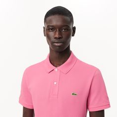 Lacoste upped the stakes in elegant sportswear game with the invention of the polo shirt in 1933. The Original L.12.12, featuring a collar, a button band and a new knit fabric, was born. The historic slim fit design features a fitted cut. Made from over 12 miles of thread, with an embroidered crocodile made up of 2367 stitches… a lesson in expertise. Classic Polo Shirt With Ribbed Collar For Golf, Classic Golf Polo Shirt With Ribbed Collar, Classic Pink Polo Shirt, Classic Pink Collared Polo Shirt, Classic Pink Top With Ribbed Collar, Fitted Polo Shirt With Ribbed Collar For Golf, Fitted Pink Sporty Polo Shirt, Classic Solid Polo Shirt For Golf, Classic Polo Shirt With Seamless Collar For Golf