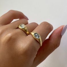 a woman's hand with a ring on it