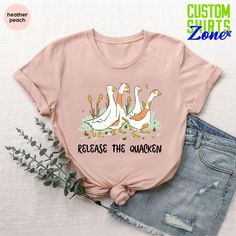 three geese with the words release the quackn on it's chest shirt