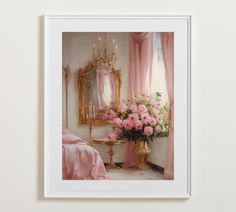 pink flowers are in a gold vase next to a mirror on a white wall with curtains