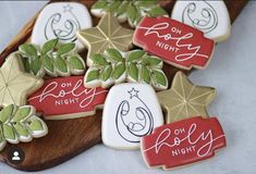 decorated christmas cookies on a wooden platter