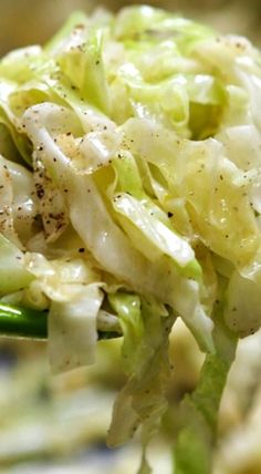 a close up of a spoon with some food on it