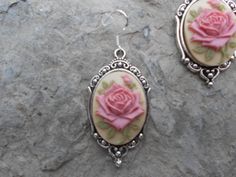 "For sale are beautiful flawless (perfect pink rose with a single bud, with green leaves on a tan/beige background) cameo pendant necklace and matching earrings set The cameos are gorgeous, very detailed They are offered at a reasonable price, make perfect gifts, and are wonderful quality The cameo is set in an ornate tibetan silver setting, and the chain is 22\" .925 silver plated 1.2mm snake chain, with a lobster claw clasp The earrings match perfectly, and the earring hooks are .925 silver pl Classic Rose Design Jewelry For Gifts, Vintage Rose Design Jewelry In Rose Color, Vintage Rose Design Jewelry, Pink Flower Jewelry With Rose Design, Classic Rose-colored Formal Jewelry, Rose Classic Formal Jewelry, Nickel-free Rose Flower Jewelry, Feminine Pink Jewelry With Rose Design, Rose Oval Jewelry With Rose Design