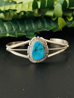 Navajo Made Kingman Turquoise Sterling Silver Cuff Bracelet. It measures 1 inch wide with an inside circumference of 5 3/8 inches and a gap of 1 1/8 inches. Signed by the artist and stamped sterling silver.   Thank you for checking out my store, if you have any questions please contact me!!    Exported By ExportYourStore :) SKU:490865486400_6B23* Western Turquoise Bangle Cuff Bracelet, Western Style Turquoise Bangle Cuff Bracelet, Western Style Blue Cuff Bangle Bracelet, Western Style Blue Bangle Jewelry, Southwestern Turquoise Bangle, Western Style Blue Cuff Bracelet Gift, Sterling Silver Cuff Bracelet, Kingman Turquoise, Sterling Silver Cuff