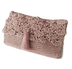 a crocheted purse with a tasselled handle