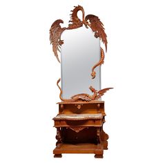 an ornate mirror sitting on top of a wooden table next to a shelf with drawers