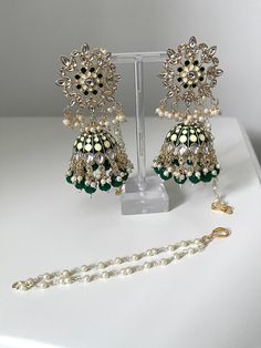 A stunning pair of hand painted Kundan Indian jhumkas/jhumki earrings.  These earrings come in a variety of different colours.   These are very lightweight and can be worn with all outfits.   Please follow our instagram page - Sakavano Jewellery Please note we do not offer refunds or exchanges due to hygiene reasons. Green Dangle Chandbalis For Festivals, Green Dangle Jhumkas For Festive Occasions, Green Dangle Chandbalis With Latkans, Green Latkan Bridal Earrings For Diwali, Festive Green Chandbalis Dangle, Green Latkans Bridal Earrings For Diwali, Green Bridal Earrings With Latkans For Diwali, Green Danglers With Latkans, Green Meenakari Dangle Danglers