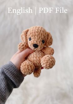 a person holding a small teddy bear in their hand with the caption english / pdf file