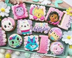 there are many decorated cookies on the tray