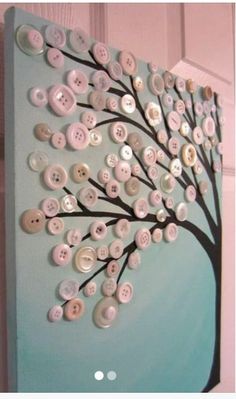 a tree made out of buttons on a wall