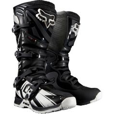 a pair of black and white motorcycle boots