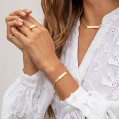 Add a personal touch to this edgy, engravable tag bracelet. Product Details Engravable 6 1/4" chain + 1" extender Total length 7 1/4" 3/16" wide chain Bar 1 3/8" by 3/16" Spring ring closure Engraving component 18k gold vermeil All other hardware 18k gold plated brass Avoid contact with anything containing derivatives of alcohol Inappropriate Language We are unable to process any engraving request containing profanities or inappropriate language. Where possible, we will contact you to seek an al Classic Adjustable Recycled Gold Jewelry, Tarnish Resistant Gold Double Band Jewelry, 14k Gold Double Band Jewelry As Gift, 14k Gold Double Band Jewelry Gift, Fine Jewelry Yellow Gold Double Band, Tarnish-resistant Gold Double Band Jewelry, Yellow Gold Double Band Fine Jewelry, Gold Tarnish-resistant Double Band Jewelry, Classic Stackable Bracelet Jewelry