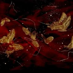 some gold butterflies on a red and black background with white stars in the sky above them