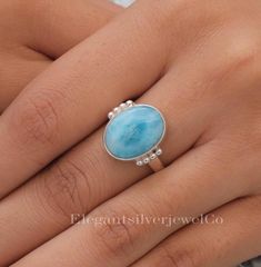 Dominican Larimar Ring / 925 Sterling Silver Ring / Oval Gemstone Ring / Bohemian Jewellery / Anniversary Gift For Wife Gemstone Name - Larimar Stone Quality - AAA Ring Wight - 4.88 gm  Ring  Length -1.7 cm  Ring  Width - 1.7 cm Stone Shape - As shown in the picture Ring Size - All Ring Size Available You'll get the exact product as shown in the pictures We serve complete 925 sterling silver Jewelry and genuine properties of the stone. The products are dispatched from the small business from USA. Product Quality and Packaging - Our all products are 925 Silver Stamped which shows that the product is genuine and authentic .The products are dispatched from the small business from USA so you get the product on time and the product packaging comes in bubble foil wrap with all the precautions ta Oval Natural Stone Rings For Anniversary, Oval Rings With Natural Stones For Anniversary, Oval Natural Stones Anniversary Rings, Elegant Larimar Rings For Anniversary, Oval Turquoise Sterling Silver Ring For Wedding, Elegant Oval Larimar Rings, Oval Turquoise Ring In Sterling Silver For Wedding, Fine Jewelry Sterling Silver Oval Turquoise Ring, Oval Turquoise Ring In Sterling Silver