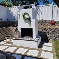 an outdoor fireplace in the middle of a yard