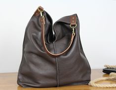 Oversized Brown Leather Hobo Bag, Everyday Large Leather Bag, Soft Leather Hobo Bag, Everyday Handbag for Women, Large Hobo Leather Bag **Dimensions Height: 18,5 inch (47 cm) Width: 18,1 inch (46 cm) Length of handle: 19,3 inch (49 cm) Bottom width: 13,4x 5,9 inch (34x15 cm) Internal pocket: 8,7x 6,7inch (22 x 17 cm) Large, very roomy bag made of thick yet soft cattle leather. The bag can be worn as a shoulder bag. Detachable shoulder strap. There is a lot of space and you can put there everythi Simple Leather Bag, Soft Leather Hobo Bag, Everyday Shoulder Bag, Slouch Bag, Large Leather Bag, Slouchy Bag, Slouch Bags, Leather Weekender, Soft Leather Bag