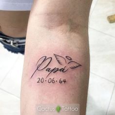 a person with a tattoo on their arm that reads papai and has two doves