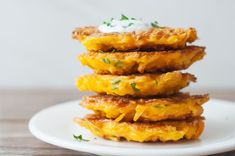 some food is stacked up on a white plate