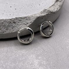 Delicate minimal sterling silver jewelry. Our products are made with 925 sterling silver and are hypoallergenic and nickel free. ✨ This listing is for a PAIR of earrings.  ✨ Earring dimensions Outer Hoop Diameter: 9mm Inner Hoop Diameter: 7mm Width of Hoops: 3mm ✨ Material 925 sterling silver  Your earrings will come in a cute gift box! We will ship them out asap, shipping is fixed price for as many items as you want. 🎉 Our new silver supply shop: https://www.etsy.com/shop/InspireSilver Nickel-free White Gold Sterling Silver Huggie Earrings, Hypoallergenic Silver Huggie Earrings In Sterling Silver, Hypoallergenic Silver Sterling Huggie Earrings, Hypoallergenic Sterling Silver Huggie Earrings, Silver Sterling Huggie Earrings Tarnish Resistant, Minimalist Polished Sterling Silver Huggie Earrings, Silver Sterling Silver Huggie Earrings For Gift, Everyday Sterling Silver Huggie Jewelry, White Gold Sterling Silver Huggie Earrings As Gift