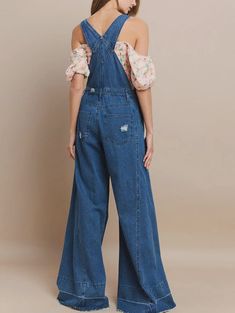 Embrace the bold and adventurous style of our Wide Leg Distressed Denim Overalls! These overalls feature a wide leg design and distressed details, perfect for those who love taking risks and standing out. Made with high-quality denim, these overalls are both fashionable and functional for any occasion. Experience ultimate comfort and style with our Wide Leg Distressed Denim Overalls! These jumpsuits are designed for women who want to feel comfortable without compromising on their fashion sense. Dark Wash Wide Leg Cotton Overalls, Dark Wash Full-length Denim Jumpsuit, Spring Full Length Denim Jumpsuit, Denim Blue Overalls With Frayed Hem, Trendy Wide Leg Cotton Overalls, Medium Wash Full Length Overalls For Spring, Full-length Medium Wash Overalls For Spring, Full Length Medium Wash Overalls For Spring, Dark Wash Wide Leg Relaxed Fit Overalls