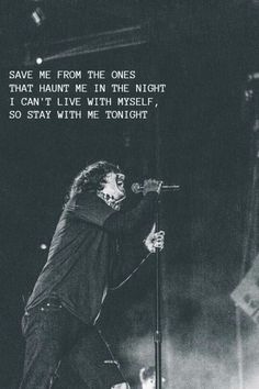 an image of a man singing on stage with the words save me from the ones that hunt me in the night i can't live with myself, so stay with me tonight