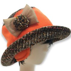 tweed hat.Warm orange hat for women with nature Golden Tiger Eye Tumbled Stone. Wool and fleece hat. With wide brim. Hat bucket with bow and stones. 22-23in. (55-58sm) (S-M) New! Fashionable hats for the winter of 2022. Designers recommend. The hat will always protect you from the cold. You are adorable in this hat and decorate the street. You just need to reach, shake and put on, slightly pushing the edges with your hands. The hat is made by hand by designers from Estonia. The hat has a lining and wadding, the fabric itself is wool, fleece, and a decoration with a gold tiger's eye, a lot of stones. Orange brimmed hat. a rough, unfinished woolen fabric, of a soft, open, flexible texture resembling cheviot* or homespun, but more closely woven. It is made in either plain or twill weave and m Orange Wide Brim Hat For Winter, Orange Wide Brim Winter Hat, Adjustable Wool Bucket Hat, Orange Brimmed Hat For Fall, Adjustable Cloche Felt Hat For Fall, Orange Hat With Short Brim, One Size Fits Most, Orange Short Brim Hat, One Size, Orange Short Brim Hat, One Size Fits Most, Orange Wide Brim Hat For Fall