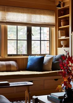 a living room filled with furniture and lots of windows