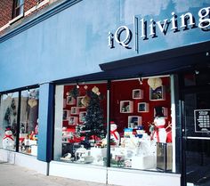 a store front with christmas decorations in the window