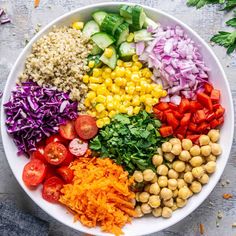 a white bowl filled with different types of vegetables