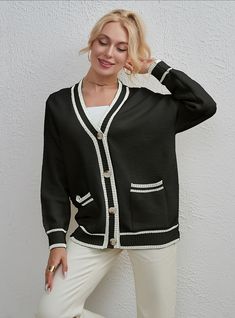 Let us introduce you to the cardigan that strikes the perfect balance between casual and elegant. This black piece is far from ordinary with its loose fit, V-neckline, and cozy long sleeves. What truly sets it apart is its unique two-tone color matching. The buttons running down the front add that extra oomph, making it the cardigan that you'll reach for again and again. Versatile in its ordinary length, this is the sweater that your wardrobe has been waiting for.Pattern: color matchingStyle: ca Oversized Black V-neck Cardigan, Black Casual V-neck Sweater For Work, Casual Black V-neck Sweater For Work, Black Long Sleeve V-neck Sweater For Work, Black V-neck Outerwear For Layering, Black V-neck Cardigan For Work, Black Sweater With Contrast Color For Spring, Casual Winter Cardigan With Contrast Color, Trendy Fall Cardigan With Contrast Color