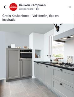 an image of a kitchen setting with grey cabinets and black counter tops on instagram