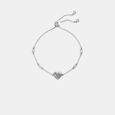 Featuring our quilted Signature heart charm this delicate chain bracelet is embellished with bezel-set crystals for subtle hints of sparkle. It’s finished with an adjustable slide closure marked with our Signature. | Coach Quilted Signature Heart Slider Bracelet - Women's - Silver Slider Bracelet, Delicate Chain, Bezel Setting, Silver Bracelets, Heart Charm, Womens Bracelets, Chain Bracelet, Sliders, Sparkle