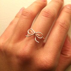 "A dainty bow ring to show someone how much you care! Looks great alone or stacked with other dainty rings. Each ring is made by hand so may differ slightly from the last, but the quality and workmanship are always the best. Sizes available: 4-14 with half sizes as well. Adjustable style version of this bow ring: https://etsy.me/2jPt1Ph IF THESE ARE FOR A BRIDAL PARTY, I WILL INCLUDE FREE RING CARDS. I have two types: 1. Thank you message (\"Thank you for helping me tie the knot!) 2. Invitation Wave Surf, Pave Wedding Rings, Blue Diamond Engagement Ring, Wire Jewelry Rings, Alternative Wedding Rings, Diy Ring, Girlfriend Christmas, Bijoux Fil Aluminium, Floating Necklace