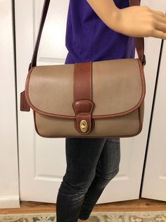 Vintage Coach Beige brown saddle pebble leather Sheridan Cross body City bag style 4225  pre- owned  Condition .Please Review Photos For More Detail measuring :  11.5" x  8" x  3"  brass hard wear .  The interior is lined . with 2  Mine pocket  and  one zip pocket .  Attach Shoulder strap  drop  20"  .  Coch hang tag  attach. Coach Coated Canvas Satchel With Zipper, Classic Textured Leather Saddle Shoulder Bag, Classic Textured Leather Flap Satchel, Brown Pebbled Leather Shoulder Bag With Leather Lining, Brown Textured Leather Crossbody Saddle Bag, Brown Textured Leather Saddle Crossbody Bag, Classic Textured Leather Saddle Bag Satchel, Classic Brown Pebbled Leather Shoulder Bag, Brown Pebbled Leather Shoulder Bag With Textured Detail