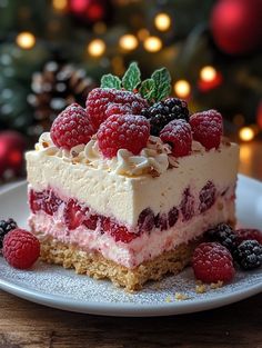 a piece of cake on a plate with berries