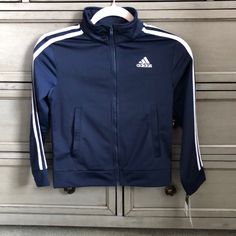 Navy Blue Zip Up Track Jacket With Pockets. Never Worn. Blue Adidas Track Jacket For Winter, Adidas Blue Track Jacket For Winter, Navy Adidas Track Jacket For Sports, Adidas Navy Track Jacket For Sports, Hooded Blue Outerwear For School, Navy Adidas Long Sleeve Track Jacket, Adidas Navy Long Sleeve Track Jacket, Navy Adidas Outerwear For Sports, Navy Adidas Sports Outerwear