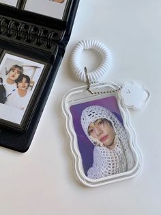 a keychain with an image of a woman wearing a bonnet and scarf on it