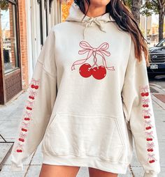 This Cherry Hoodie embodies the vintage Aesthetic with its charming retro design. The hoodie features a delightful bow, adding a touch of Y2K trendiness to its graphic crewneck style. Perfect for those embracing Balletcore or Cottagecore vibes, this shirt makes a thoughtful gift for fashion-forward individuals. For Cherry Sweatshirt: https://bronikowskiart.etsy.com/listing/1674341498 Unisex Gildan 18500 Hoodie Q U I C K / F A C T S * 50% Cotton 50% Polyester * Wash and dry normally (on cool for Oversized Y2k Hoodie For Fall, Oversized Y2k Sweatshirt For Spring, Y2k Style Cotton Hoodie With Long Sleeves, Y2k Cotton Long Sleeve Hoodie, Y2k Style Long Sleeve Cotton Hoodie, Y2k Long Sleeve Spring Sweatshirt, Y2k Long Sleeve Sweatshirt For Spring, Oversized Cute Hooded Sweatshirt, Cute Oversized Hooded Sweatshirt