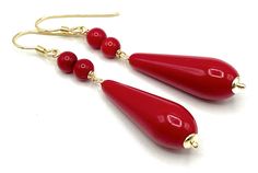 A pair of elegant earrings crafted with Italian 24 K Gold Vermeil, red coral and long red resin drops. LENGTH:  2.6 inches - 6,7 cm  WEIGTH: 5 gr.  Drop: 30 x 10 mm MATERIALS: 24 K Gold Vermeil over 925 Sterling Silver - Made in Italy Coral Resin DELIVERY: All jewellery is shipped in a working day with registered mail. All orders come packaged in a pouch drawstring bag Sofia's Bijoux: http://www.etsy.com/it/shop/Sofiasbijoux More Earrings: https://www.etsy.com/uk/shop/Sofiasbijoux?ref=simple-sho Red Drop Jewelry With Matching Earrings, Classic Red Earrings For Party, Handmade Red Earrings For Formal Occasions, Classic Red Party Earrings, Red Teardrop Earrings For Formal Occasions, Red Drop Earrings For Pierced Ears, Elegant Handmade Red Earrings, Elegant Red Pierced Earrings, Red Dangle Teardrop Earrings For Formal Occasions