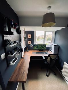 a home office with a desk and chair in the corner, next to a radiator