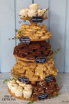 a tall tower with lots of different types of pastries on it's sides